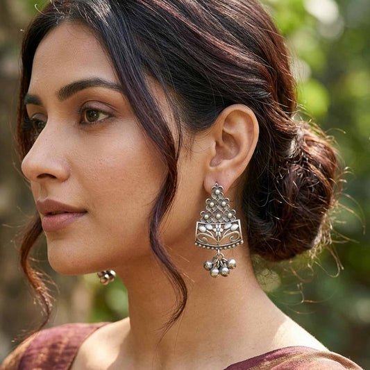 Woman wearing floral ghungroo statement earrings