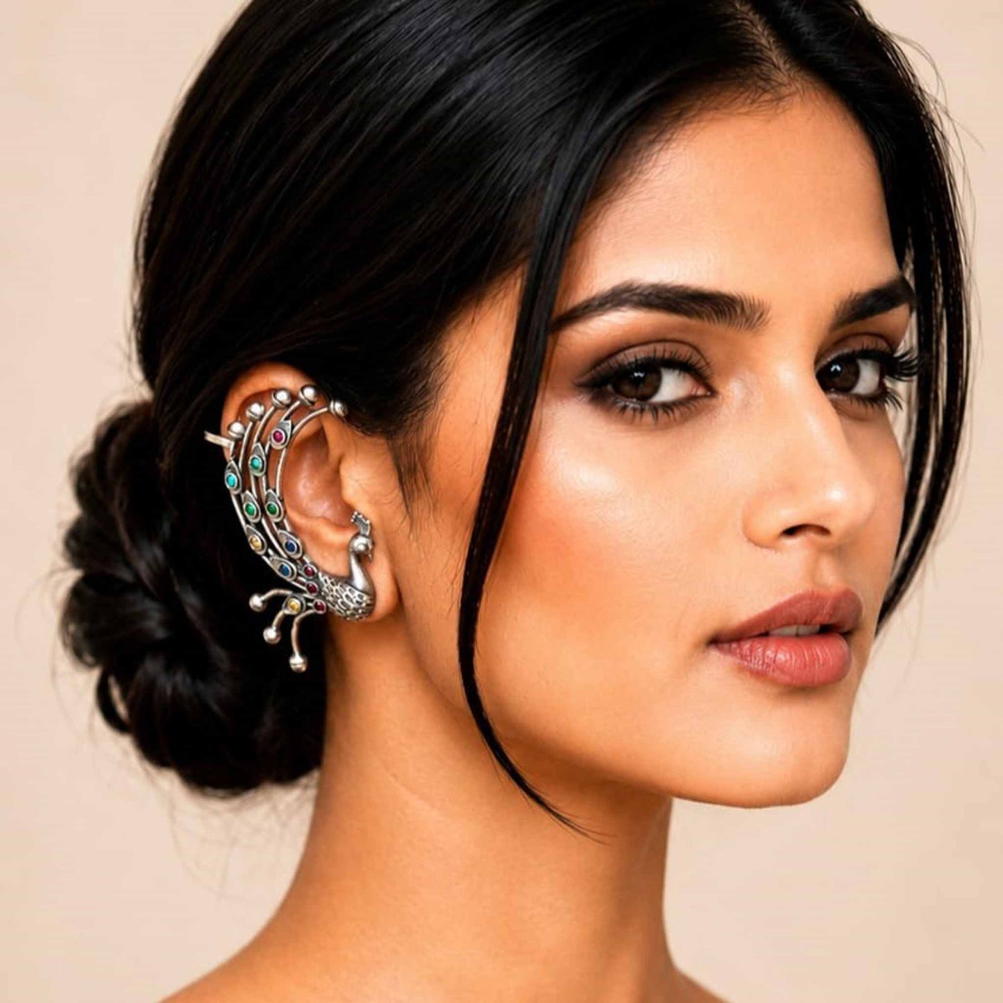 Model wearing German Silver peacock ear cuff earrings