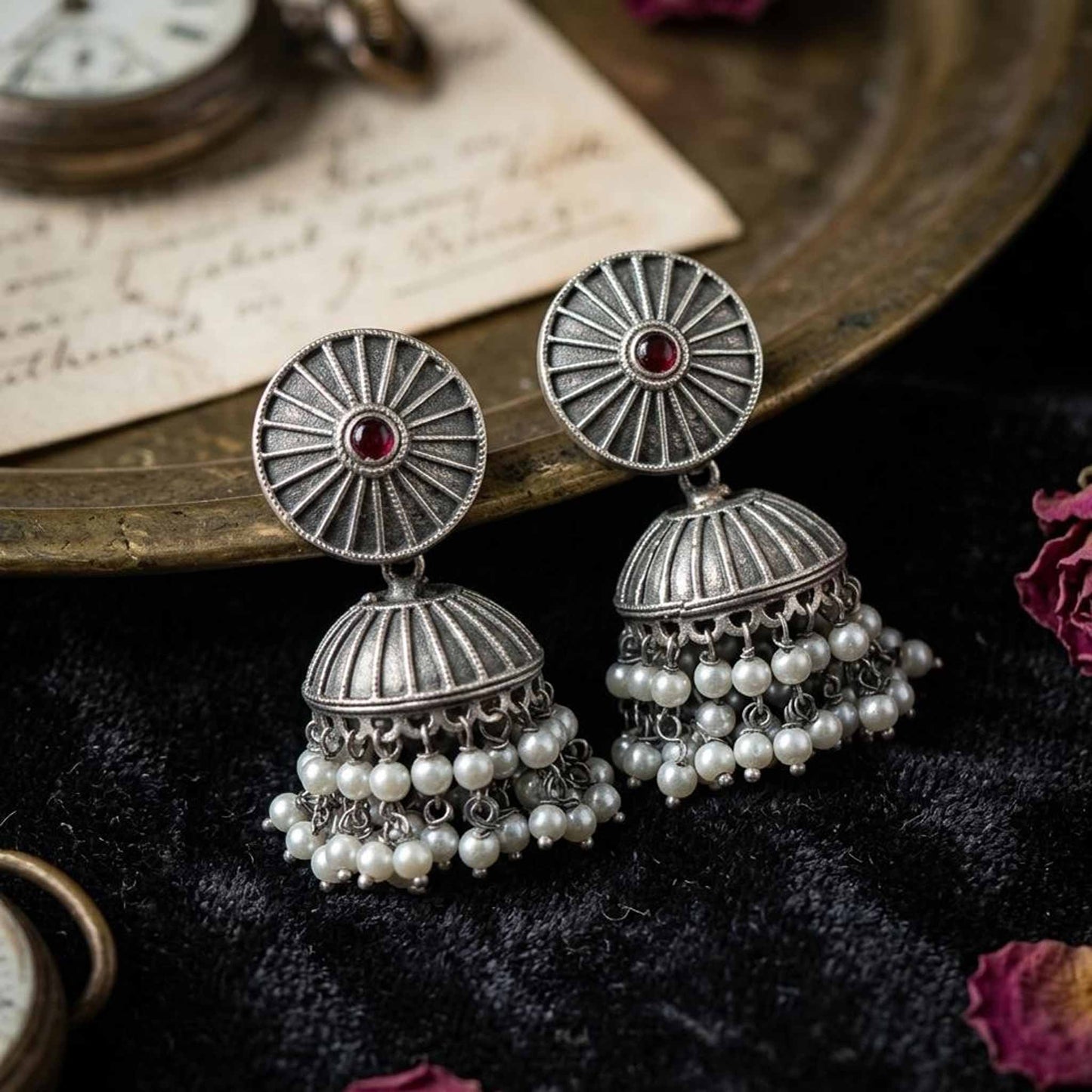 Ruby pearl jhumka earrings black background