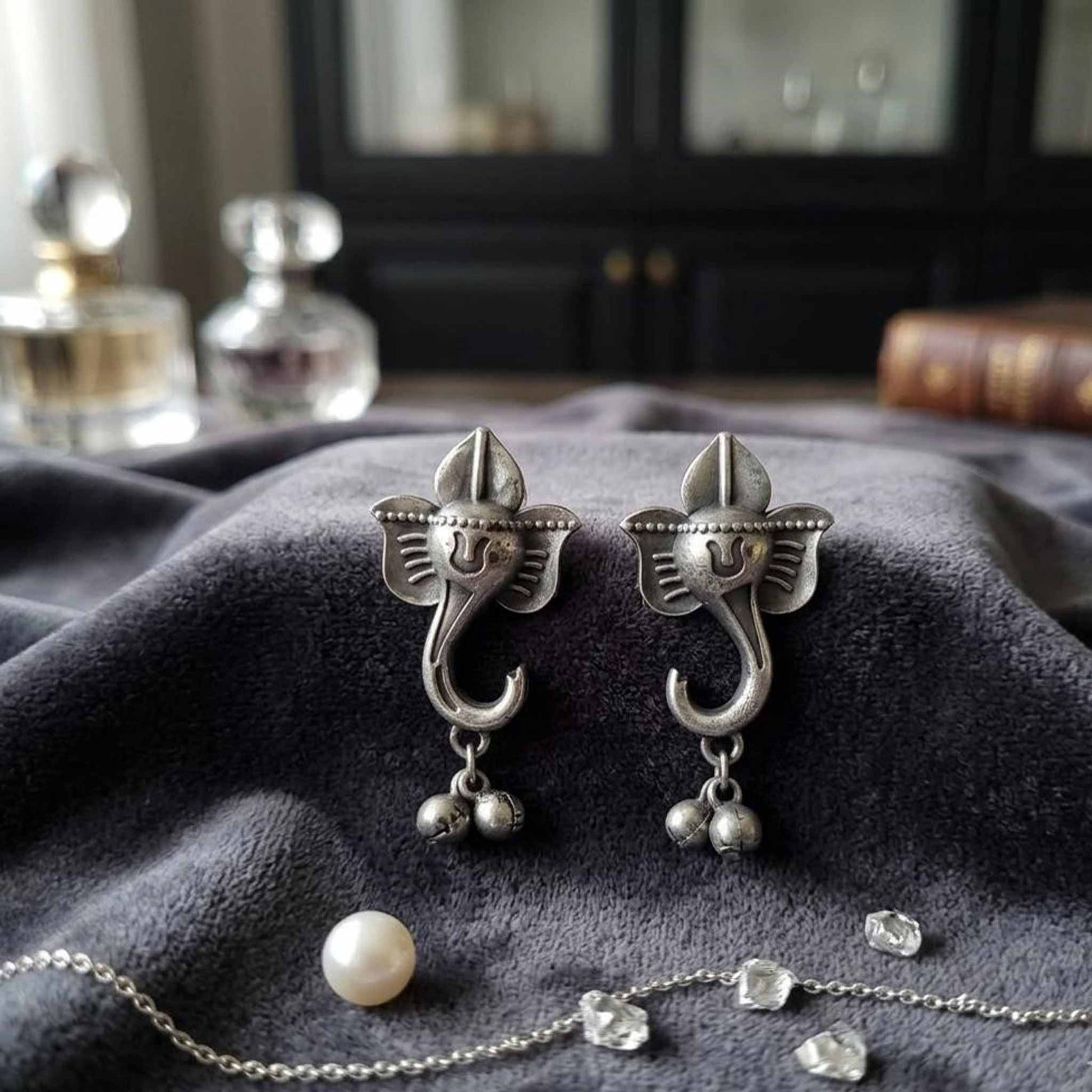Ganesha ghungroo German silver earrings front styling view