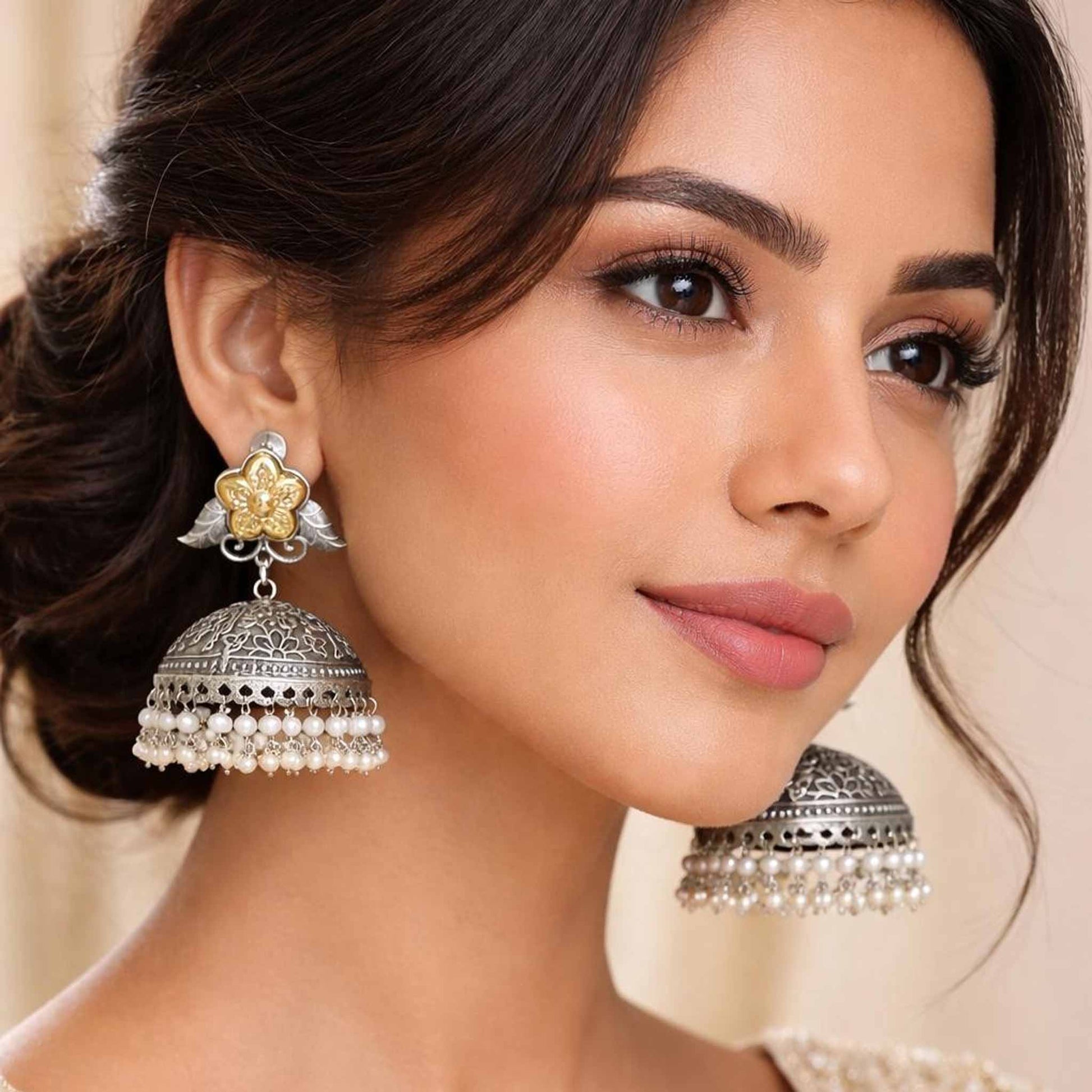 Woman wearing floral pearl jhumka statement earrings
