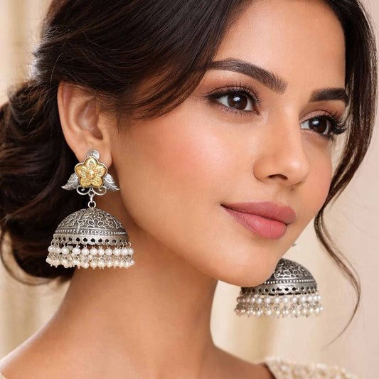 Woman wearing floral pearl jhumka statement earrings