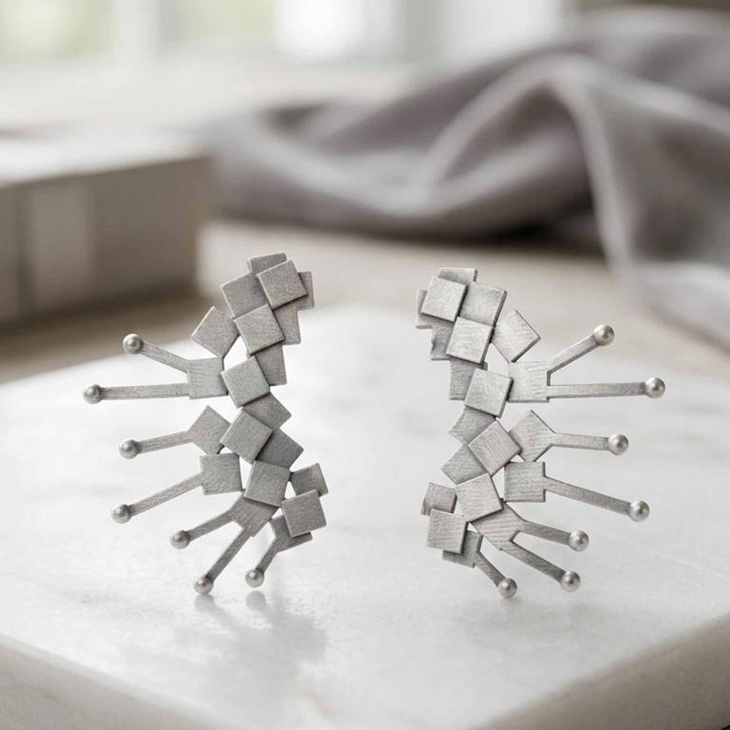 Modern geometry earrings flatlay