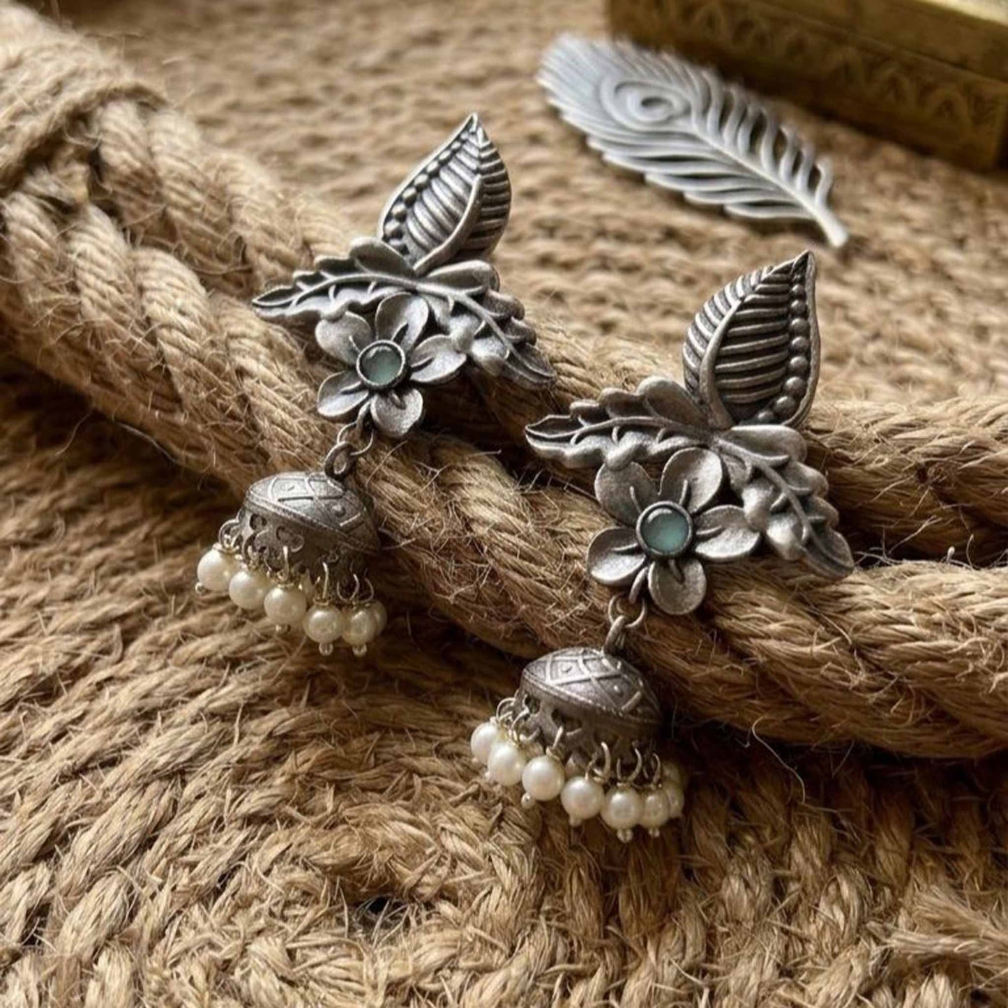 Rustic styled image of handcrafted floral pearl earrings