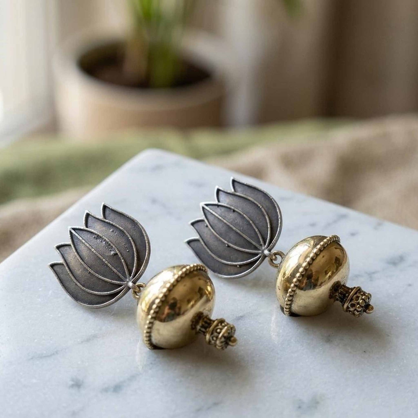 Close-up flatlay of lotus dome jhumka earrings