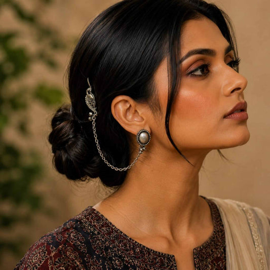 Model wearing German Silver peacock ear chain earrings
