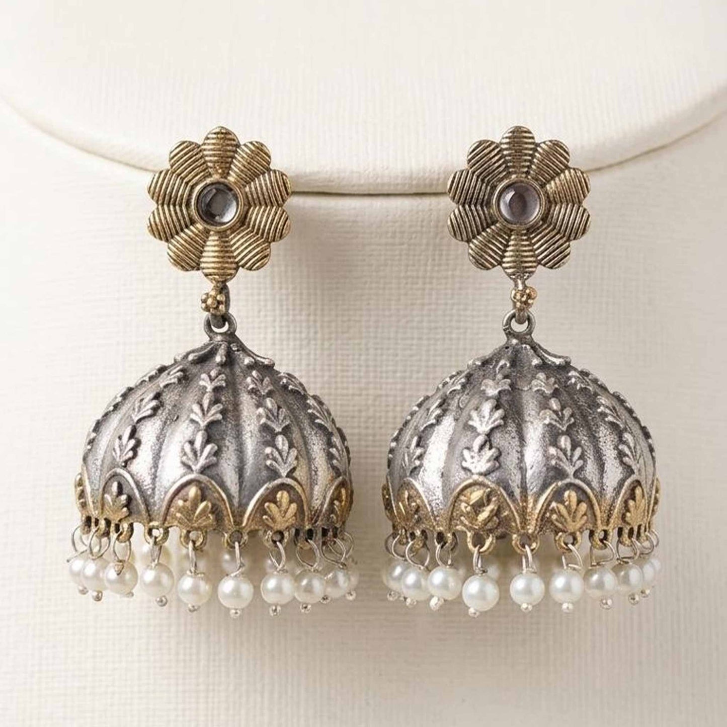Front view of dual tone pearl jhumka earrings