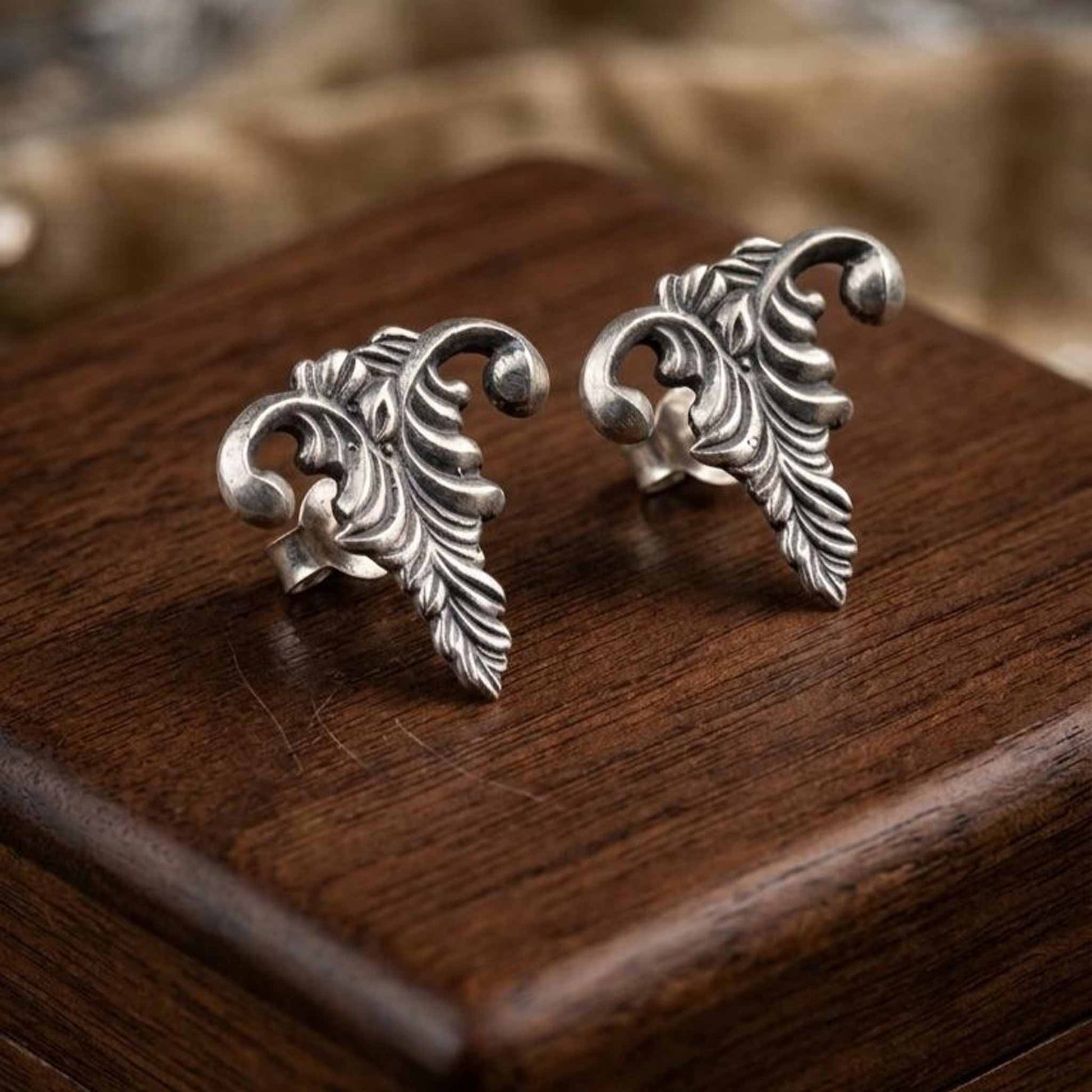 Elegant vine leaf stud earrings product display