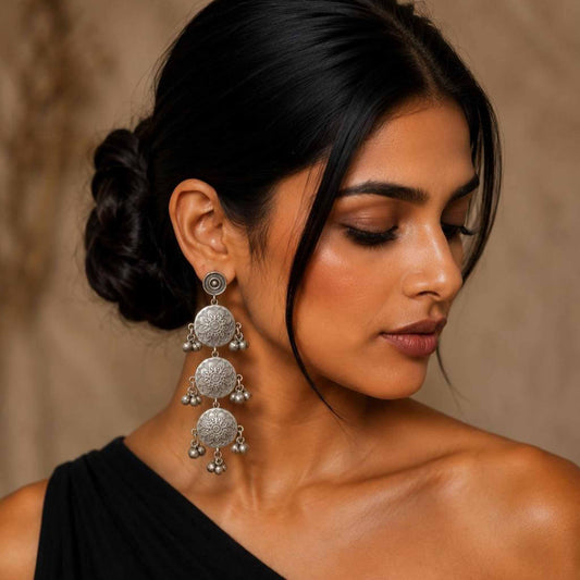Side profile model shot of long mandala ethnic dangler earrings