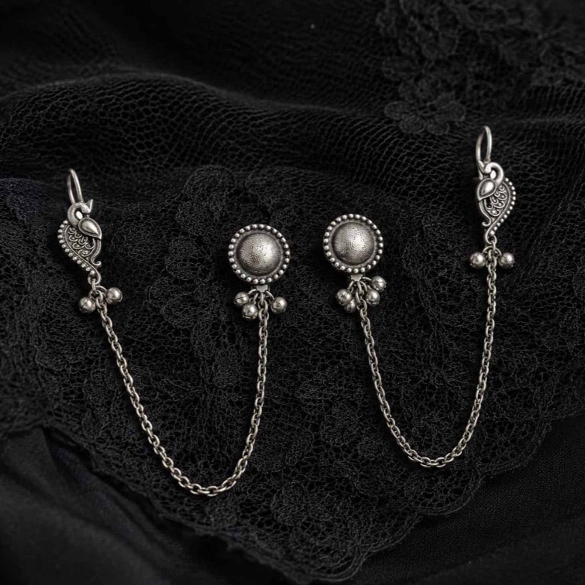 German Silver ear chain earrings on black lace fabric