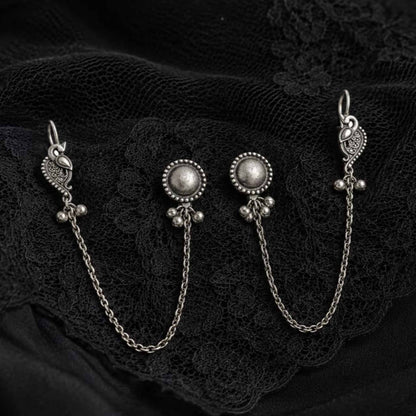 German Silver ear chain earrings on black lace fabric