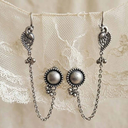 Closeup of German Silver peacock ear chain earrings