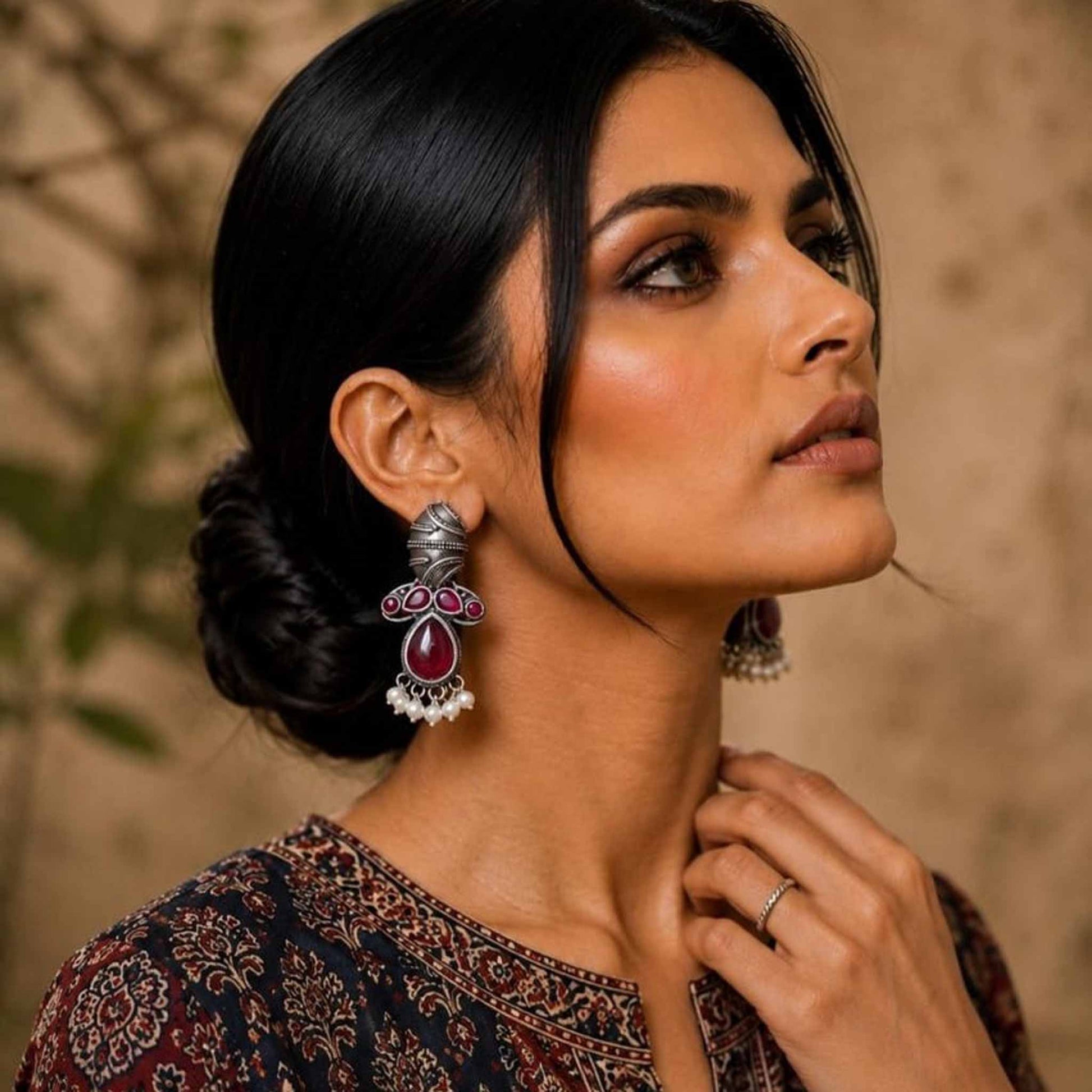 Model wearing German Silver ruby drop pearl earrings