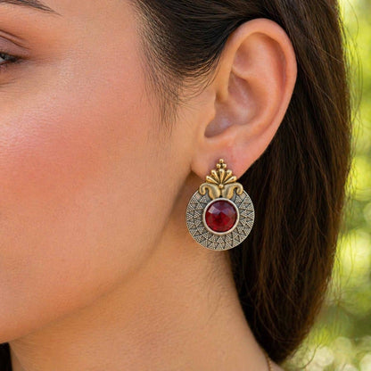 Closeup model wearing ruby dual tone statement earrings