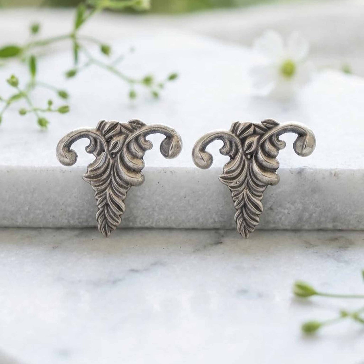Botanical antique silver stud earrings closeup