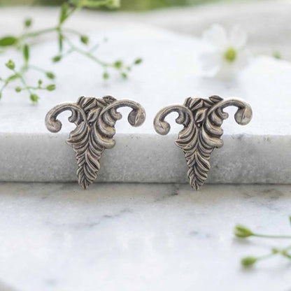 Botanical antique silver stud earrings closeup