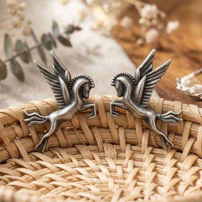 Handcrafted Pegasus German silver earrings on woven basket
