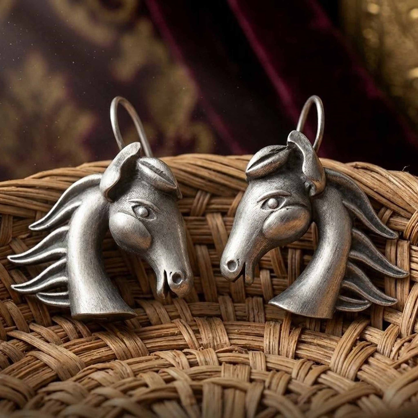Horse motif German silver earrings on woven basket
