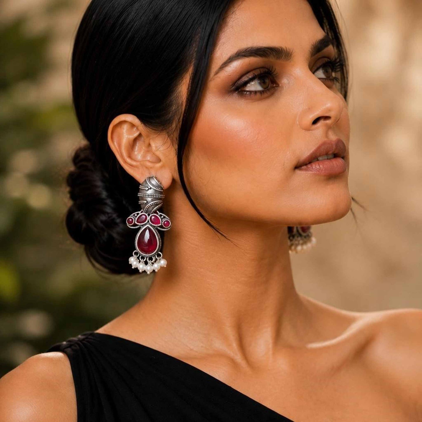 Closeup model shot wearing German Silver ruby earrings