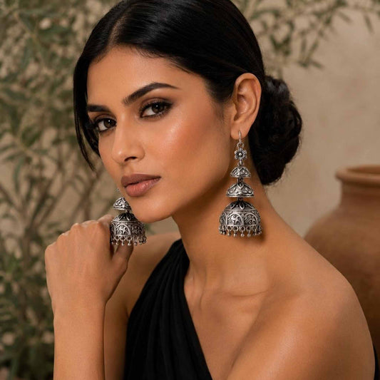 Model wearing handcrafted long dome jhumka earrings