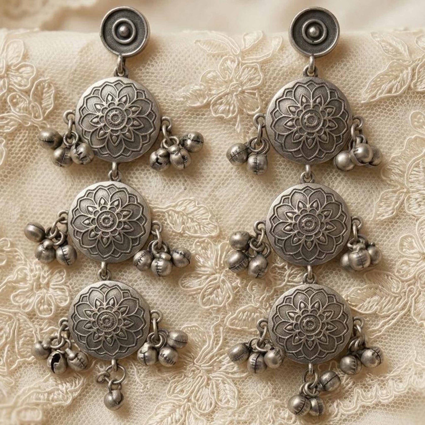 Traditional floral mandala engraved earrings flatlay