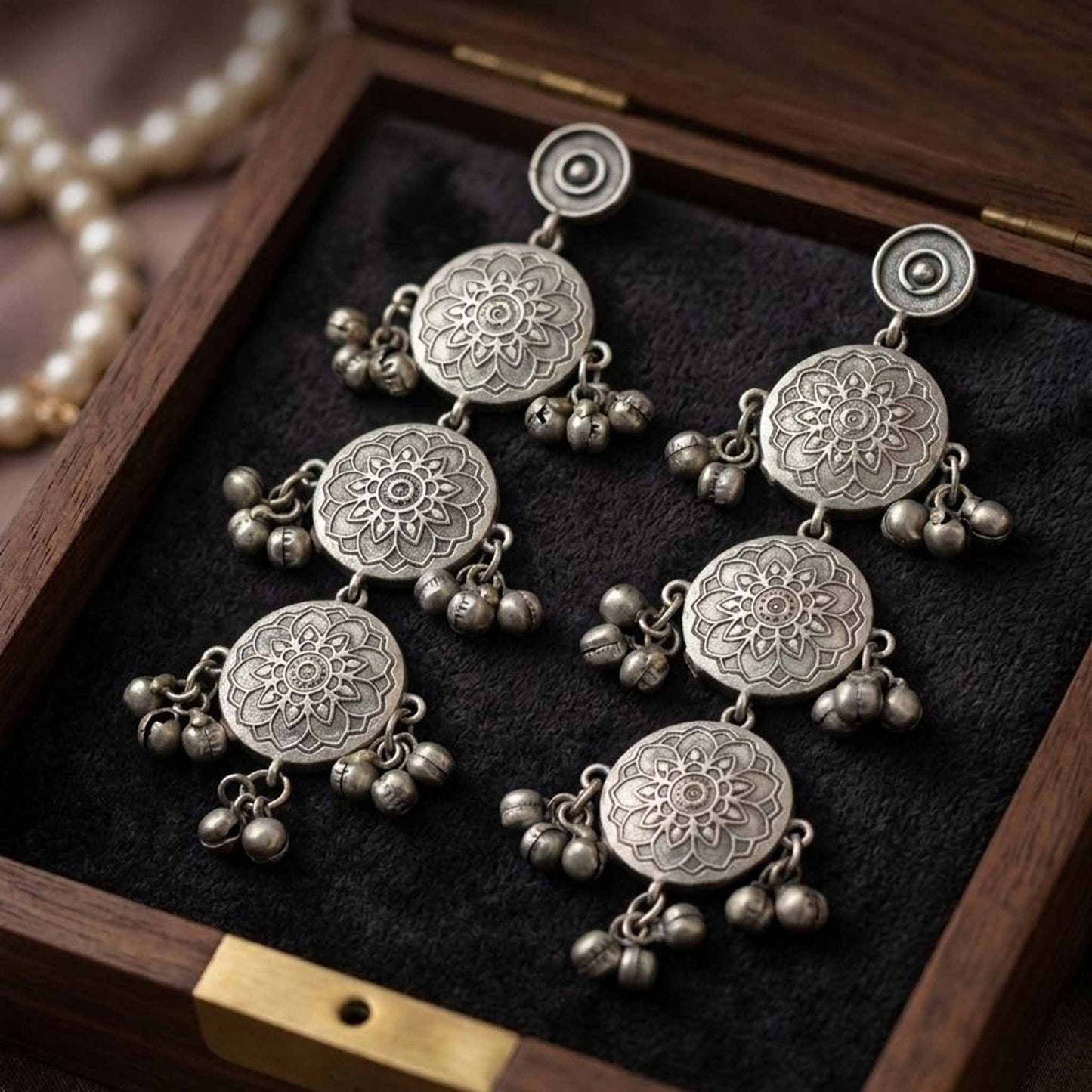 Detailed closeup of handcrafted mandala dangler earrings