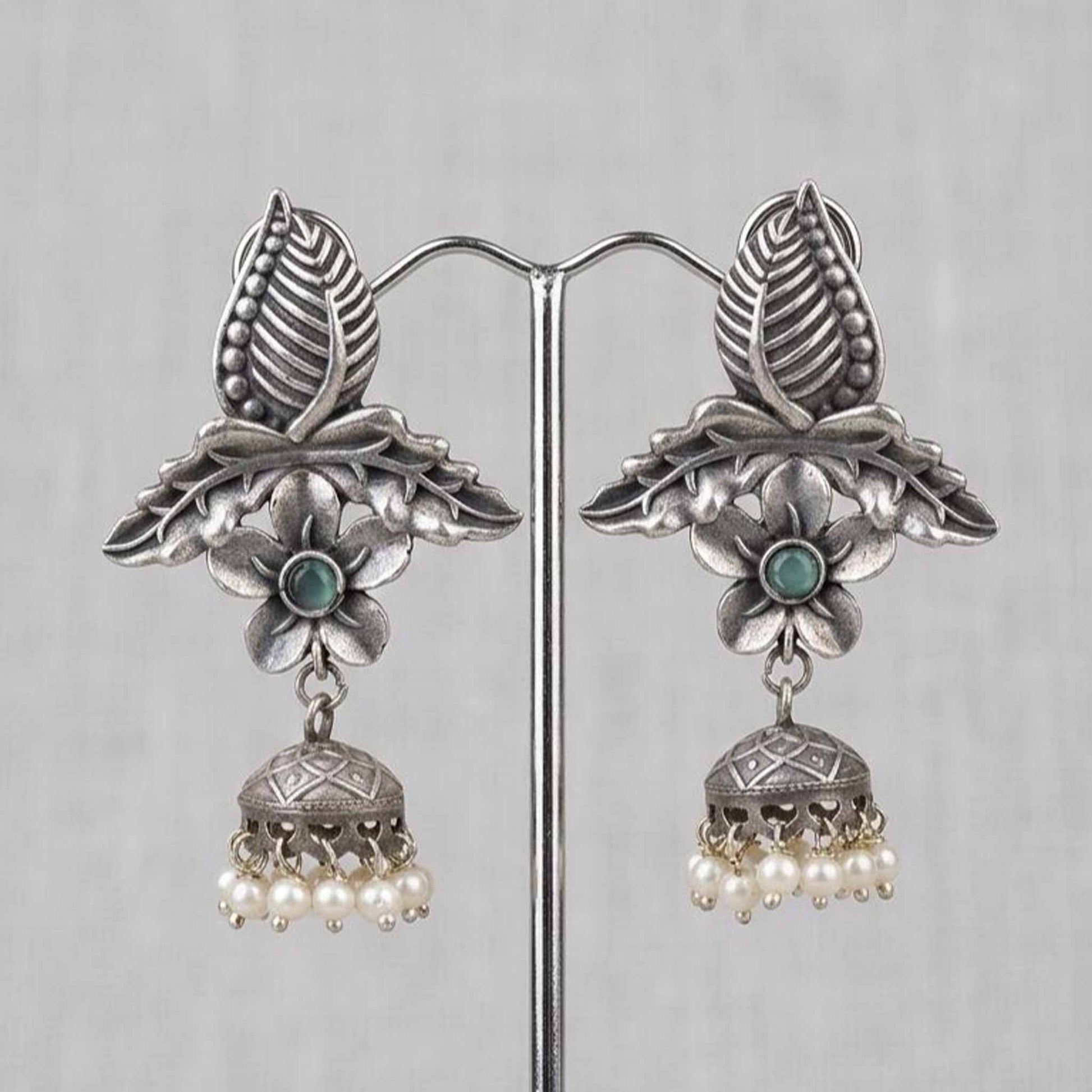 Front display of handcrafted leaf floral pearl ghumki earrings