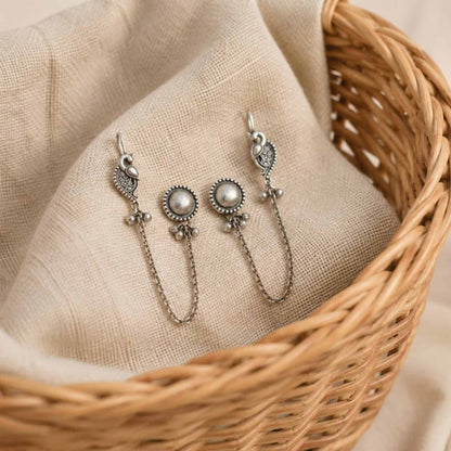 German Silver peacock earrings in wicker basket