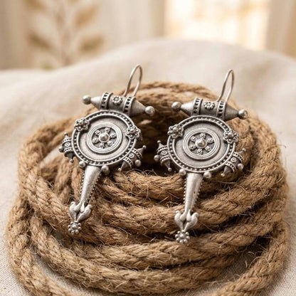 German silver tribal earrings displayed on rope styling setup