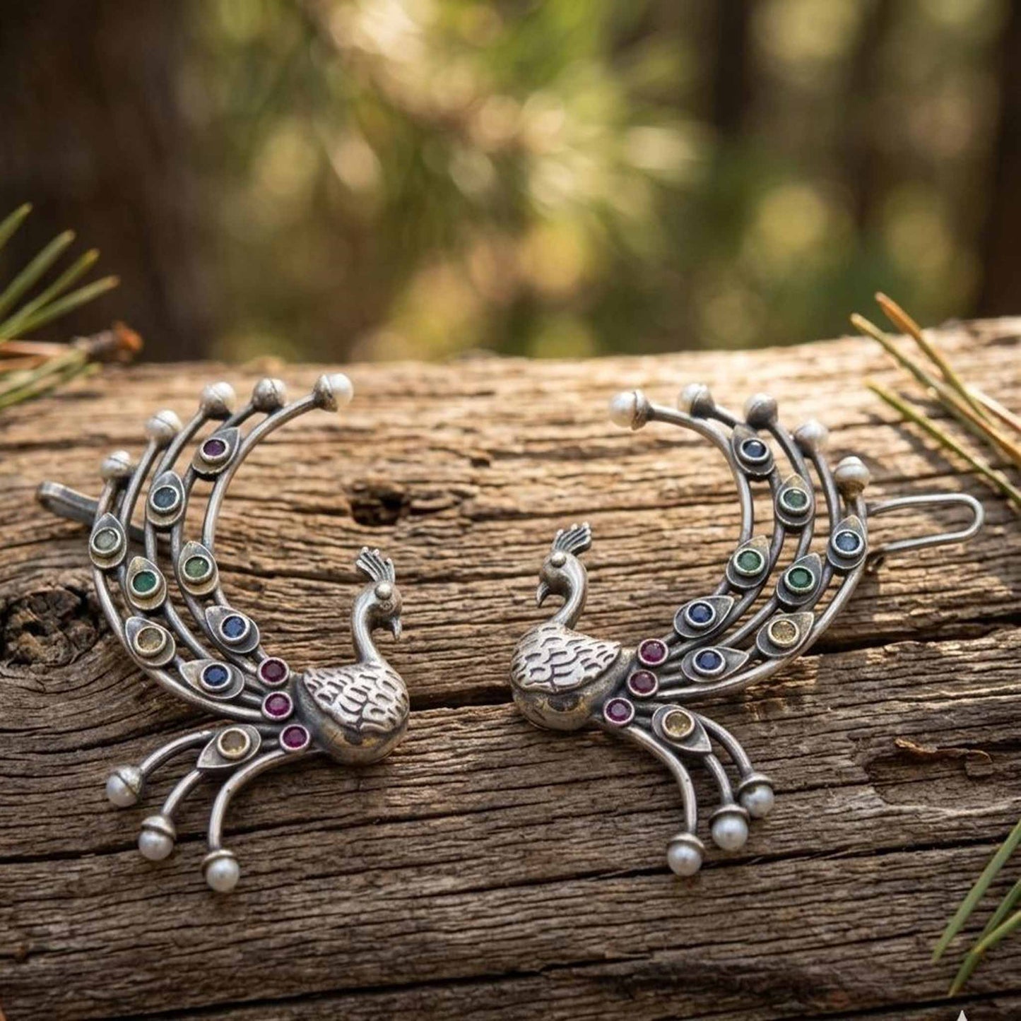 Traditional peacock ear cuff earrings on wooden texture