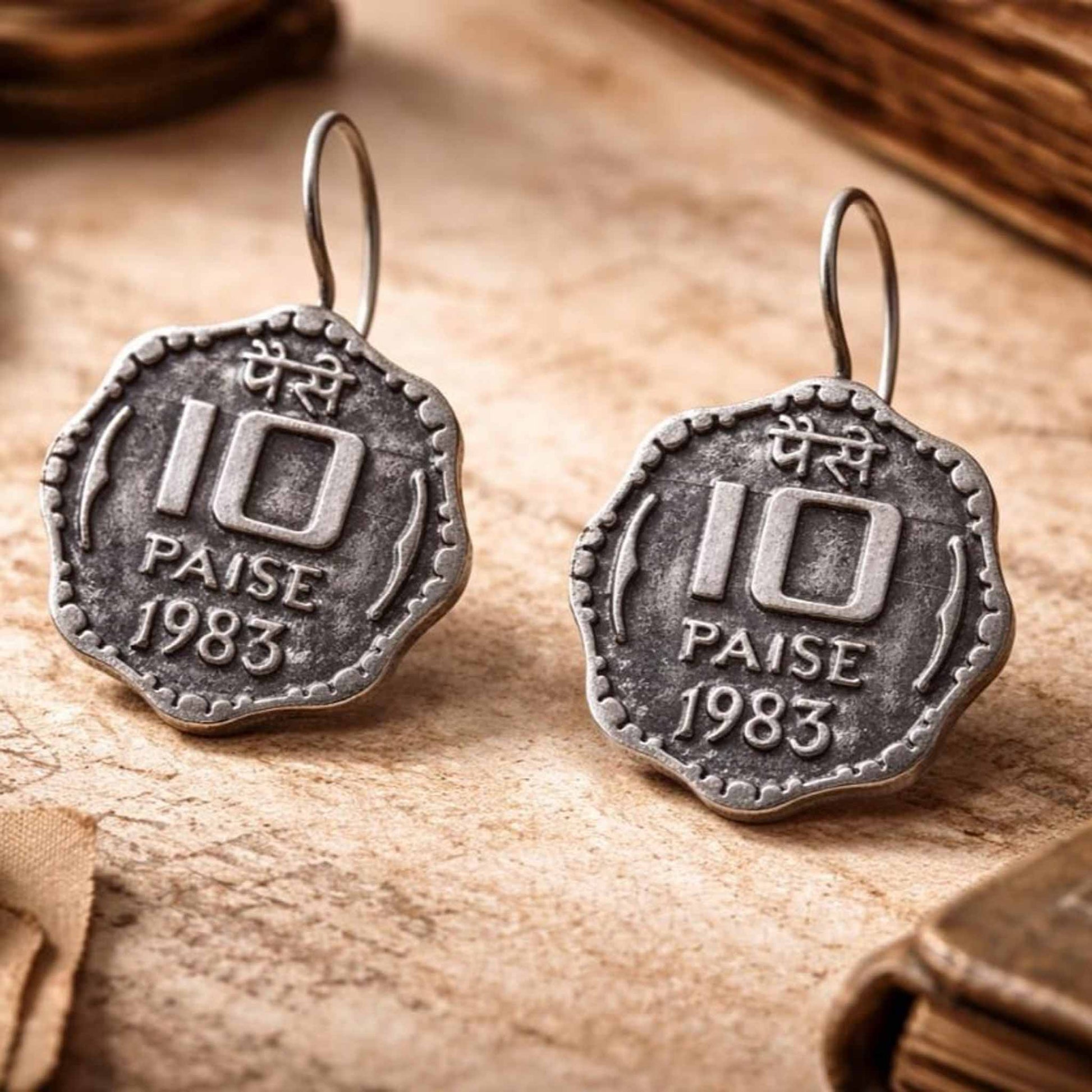 Pair of vintage 10 paise coin earrings close up