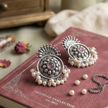 Floral German Silver pearl earrings on heritage book