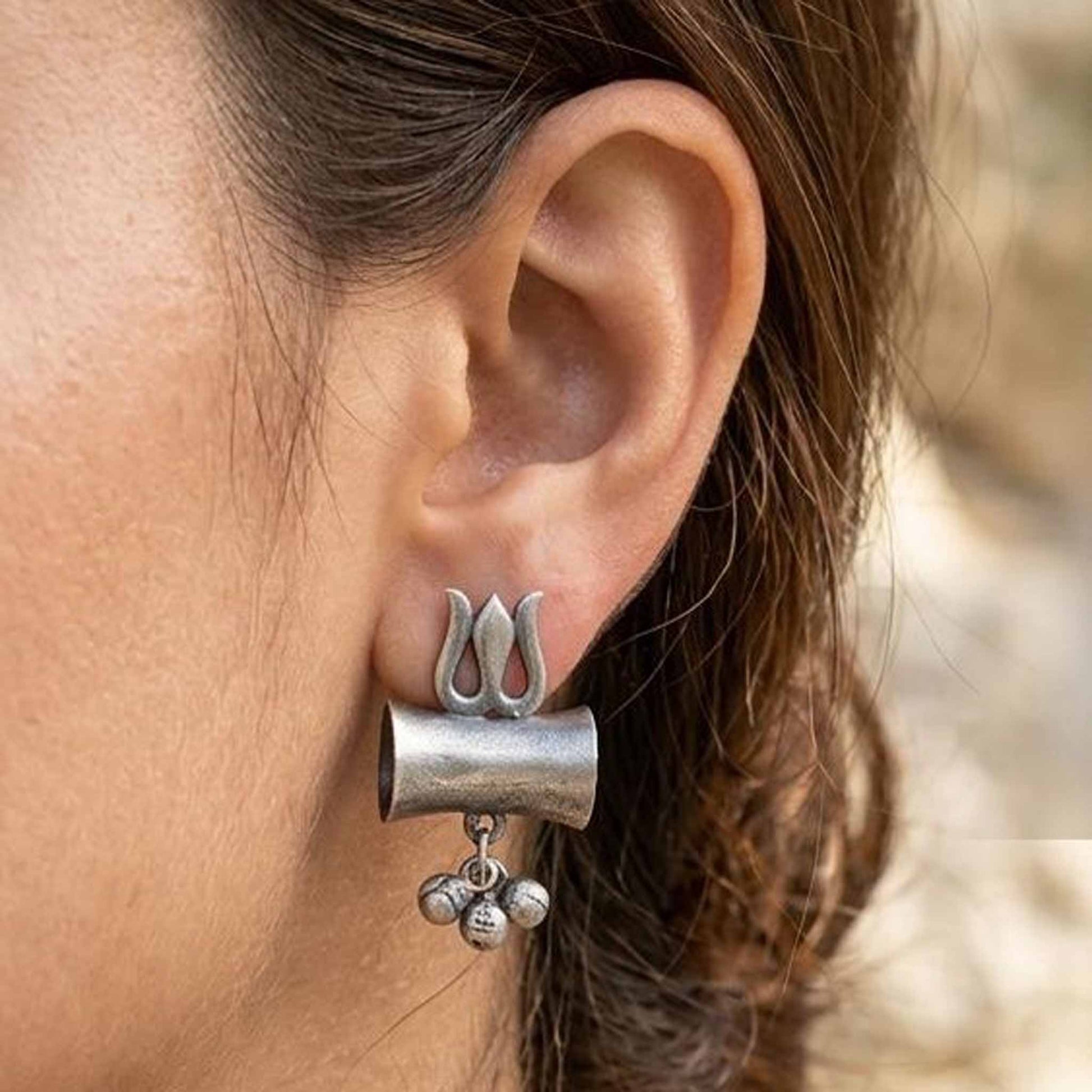Woman wearing trishul damru German Silver earrings
