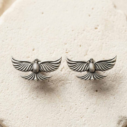 Minimal silver bird earrings product flatlay image