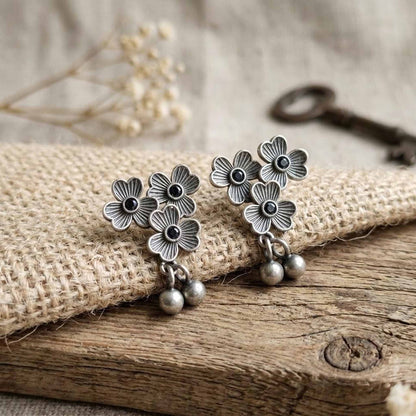 Rustic styled three flower German silver earrings with dangling beads