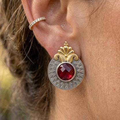 Detailed closeup of ruby dual tone statement earring