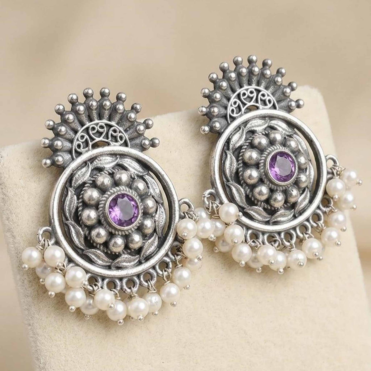 Front display of pearl German Silver floral chandbali earrings