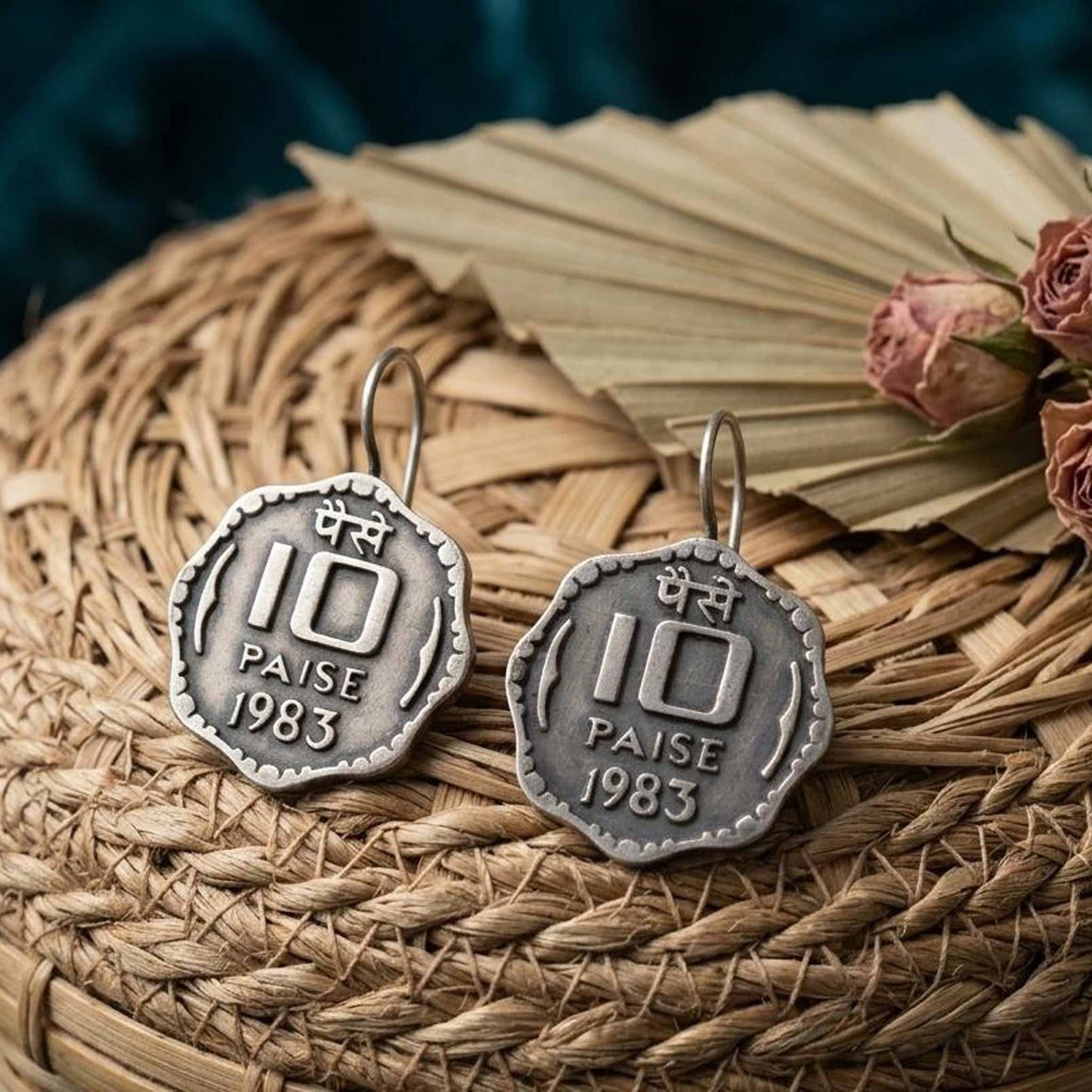 German silver 10 paise coin earrings styled on woven tray