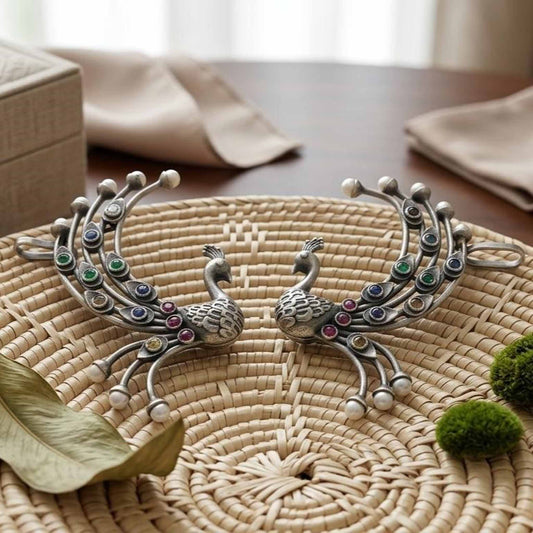 German Silver peacock stone ear cuff earrings on woven tray