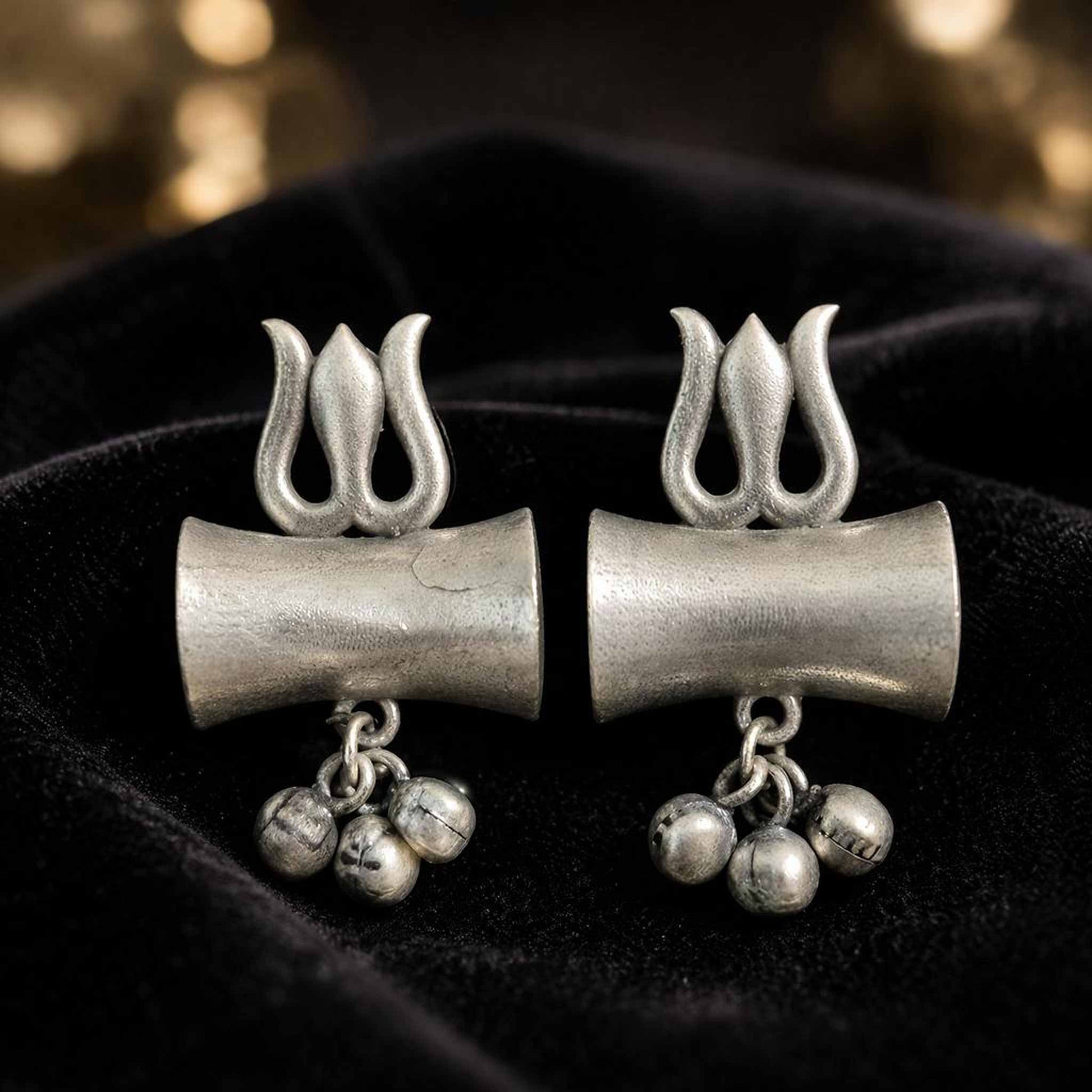 Closeup of German Silver trishul earrings with ghungroo