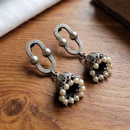 Oval Border Pearl Jhumki Earrings wooden flatlay view
