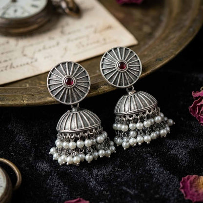 Ruby pearl jhumka earrings black background