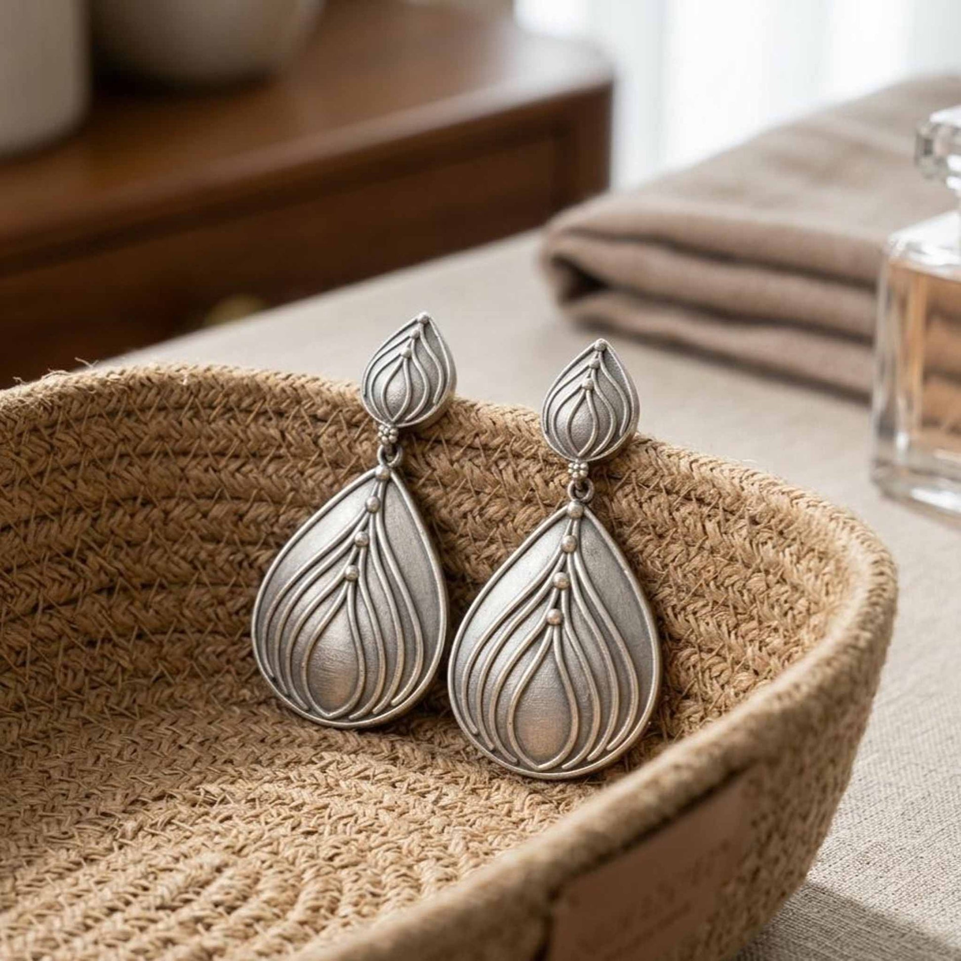 Handcrafted lotus drop earrings in woven basket styling