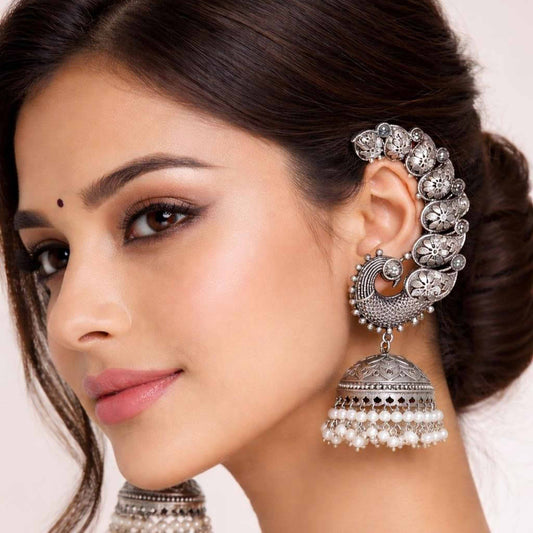 Model wearing peacock earcuff pearl jhumka earrings