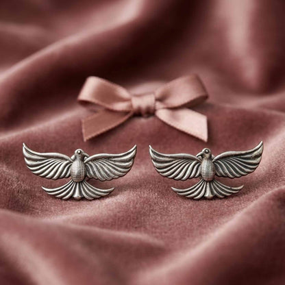 Silver flying bird stud earrings front product display