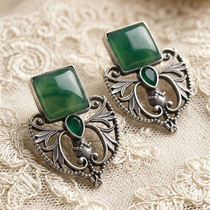 Vintage green stone earrings flatlay