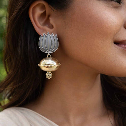 Side profile of lotus dome jhumka earrings on model