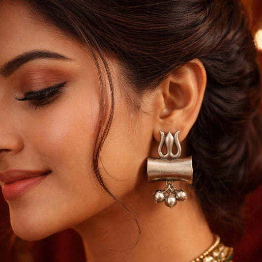 Model wearing German Silver trishul damru earrings