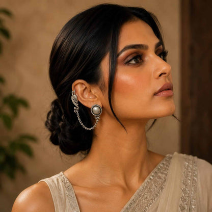 Side profile model wearing German Silver ear chain earrings