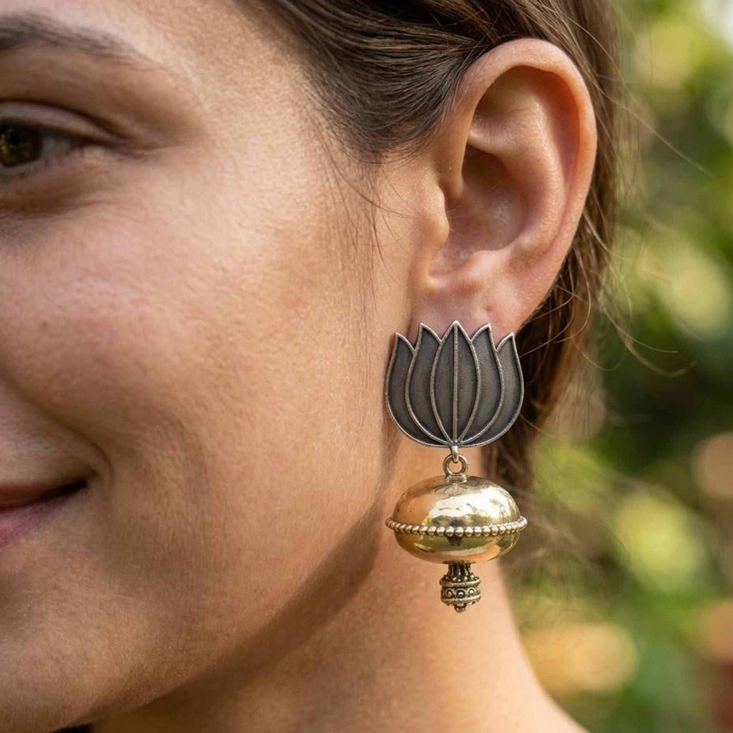 Lotus dome jhumka earrings worn by model